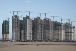 FILE - Residential apartments under construction are pictured at Forest City in Johor, Malaysia February 26, 2019.