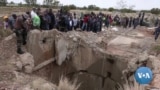 South African police try to force illegal miners from disused shaft
