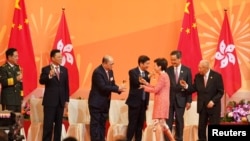 Hong Kong Chief Executive Carrie Lam toasts to Director of Safeguarding National Security of the central government in Hong Kong Zheng Yanxiong (3rd L) during a ceremony marking the 71st anniversary of the founding of People's Republic of China.