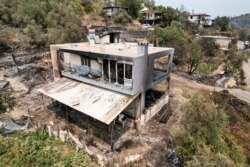 An aerial photo shows the destruction caused by wildfires near the Mediterranean coastal town of Manavgat, Antalya, Turkey, July 30, 2021.