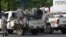 Burundi policemen patrol the street following a grenade attack in Bujumbura, Burundi. At least a dozen people were wounded Feb. 15 when attackers on a motorbike hurled three grenades n the capital.