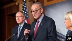 From left, Senate Majority Leader Harry Reid, D-Nev., Sen. Chuck Schumer, D-N.Y., the Democratic Policy Committee chairman, and Sen. Patty Murray, D-Wash., the Budget Committee chair, repeat their resolve to not touch the Affordable Care Act, on Capitol Hill in Washington, Sept. 19, 2013.