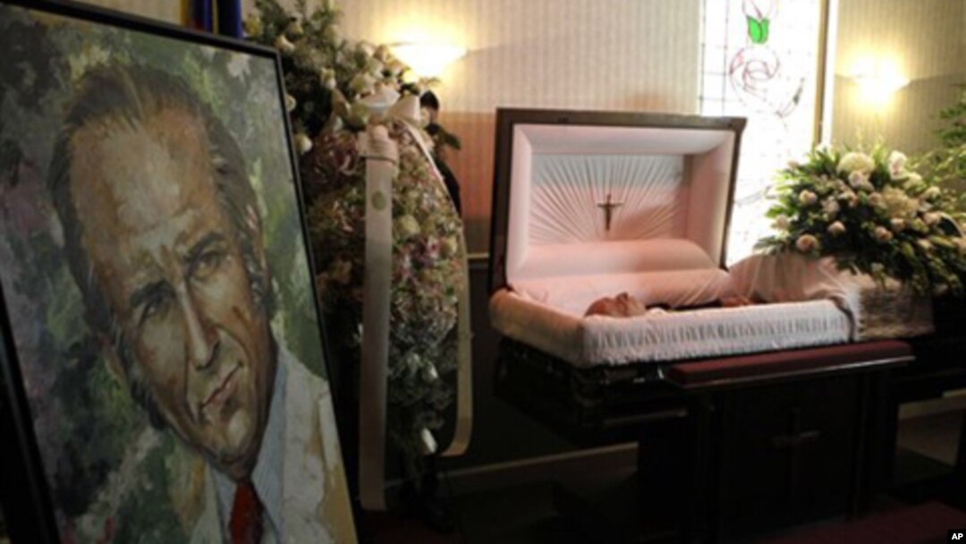 The body of the former Venezuelan president Carlos Andres Perez lies in a casket at a funeral home in Miami, Tuesday, Dec. 28, 2010