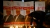 FILE - An man lights a candle during a candlelight vigil for Saudi journalist Jamal Khashoggi outside Saudi Arabia's consulate in Istanbul, Turkey, Oct. 25, 2018. 