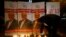 FILE - An man lights a candle during a candlelight vigil for Saudi journalist Jamal Khashoggi outside Saudi Arabia's consulate in Istanbul, Turkey, Oct. 25, 2018. 