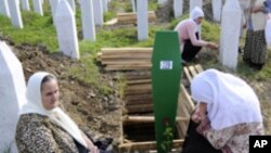 Muslims mourn at the graves for victims of the Srebrenica massacre in Potocari, Bosnia (FILE).