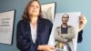 H&M Foundation Global Manager Diana Amini poses with portraits of women on its Foundation 500 list of female entrepreneurs in emerging markets in Stockholm, Sweden, June 2, 2017.