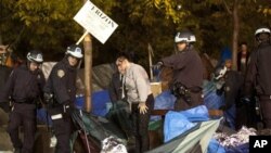 Police officers order Occupy Wall Street protesters to leave Zuccotti Park, their longtime encampment in New York, November 15, 2011.