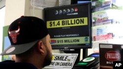 A man buys Powerball tickets at a convenience store in Lancaster, Pa., Jan. 11, 2016.