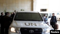 U.N. vehicles carrying a U.N. chemical weapons investigation team arrive in Damascus September 25, 2013. U.N. chemical weapons inspectors returned to Syria on Wednesday to continue investigating allegations of chemical weapons use in the country's two-and