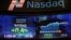 FILE - Market data is displayed on the screens at the Nasdaq MarketSite in New York, April 23, 2015. 