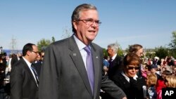 Former Florida Governor Jeb Bush and his wife Columba arrive for the dedication of the George W. Bush presidential library on the campus of Southern Methodist University in Dallas, April 25, 2013.