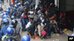 FILE: Police surround opposition party supporters who had gathered to hear a speech by the country's top opposition leader in Harare, Wednesday, Nov. 20, 2019. 