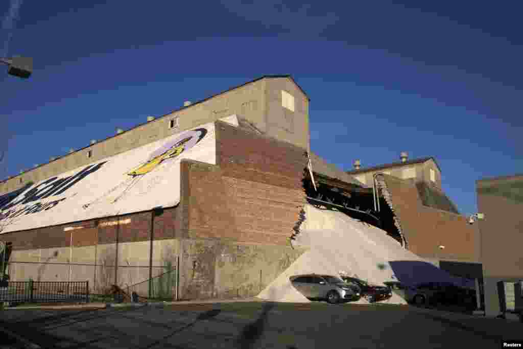 A partially collapsed wall at the Morton Salt facility gave way to tons of salt being dumped onto parked cars at an adjacent car dealership in Chicago, Illinois, Dec. 30, 2014.