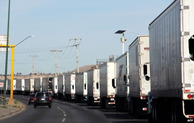 Cargo trucks lineup to cross to the United States near the U.S.-Mexico border at the Cordova-Americas International Bridge in Ciudad Juarez, Chihuahua state, Mexico, April 4, 2019.