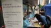 Para pekerja migran mendaftar tes COVID-19 di distrik Central, Hong Kong, Sabtu, 1 Mei 2021. (Foto: Peter Parks/AFP) 