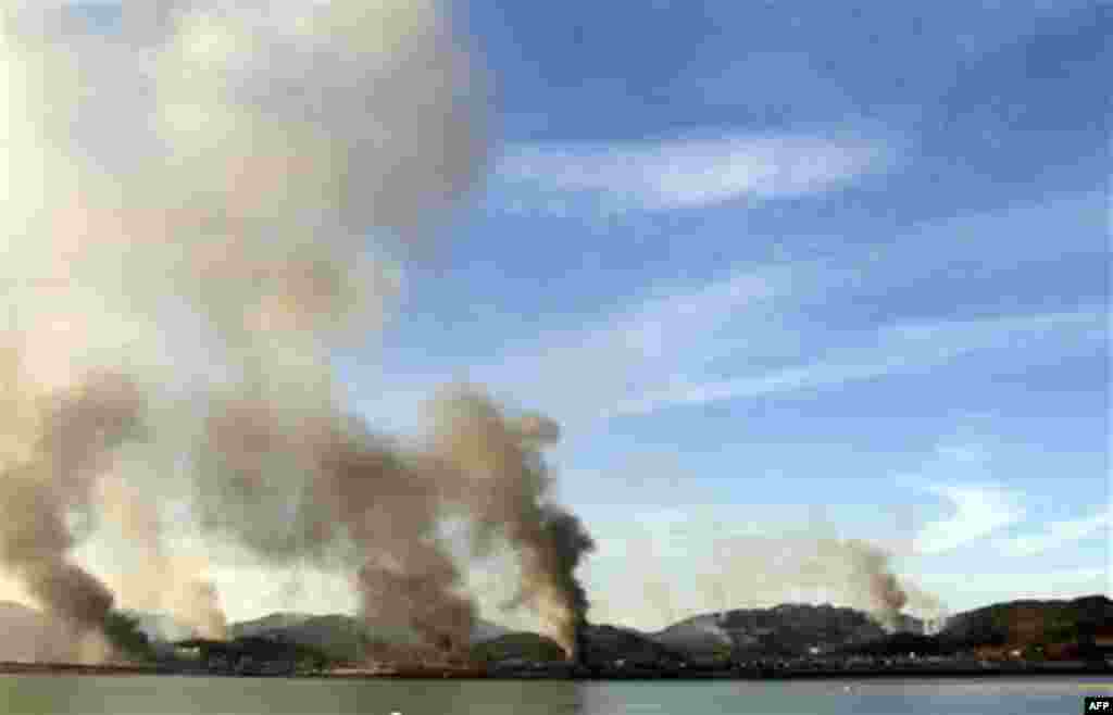 Smoke billow from Yeonpyeong island near the border against North Korea, in South Korea, Tuesday, Nov. 23, 2010. North and South Korea exchanged artillery fire Tuesday after the North shelled an island near their disputed sea border, killing at least tw