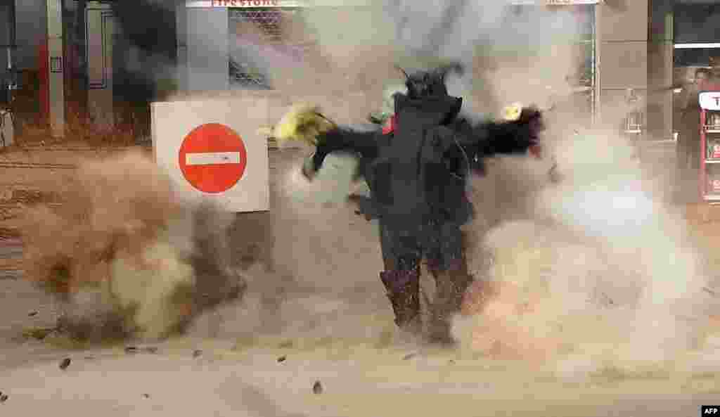 This still image grab taken from a video by the Al-Youm al-Saabi newspaper, shows an Egyptian police officer being blown up as the bomb he was trying to defuse detonated outside a petrol station in Cairo. The policeman was killed and three employees were wounded when the device, hidden in a flower pot, exploded near a police station on Al-Harram street, a busy avenue leading to the pyramids. Jihadists are claiming responsibility.