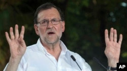 FILE - Acting Spanish Prime Minister Mariano Rajoy speaks in Seville, June 23, 2016. 