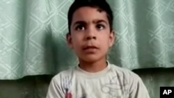 Image made from amateur video released by the Houla Media Office and accessed May 31, 2012 purports to show 11-year-old Ali el-Sayed, a survivor of the Houla massacre.