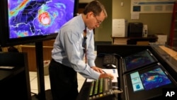 FILE - In this Sept. 2, 2010, file photo, Chief hurricane forecaster James Franklin prepares for a live update on Hurricane Earl at the National Hurricane Center in Miami.