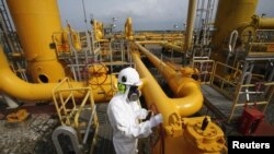 A PT Perusahaan Gas Negara Tbk (PGN) employee checks pipes at a gas receiving-and-transmitting station in Bojonegara, Banten province (File)