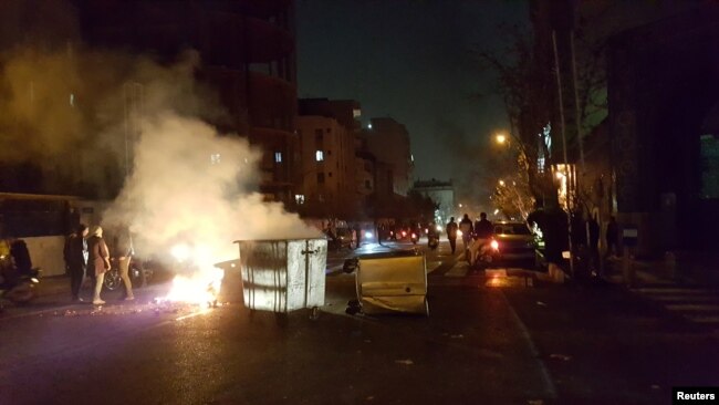 FILE - People protest in Tehran, Iran, Dec. 30, 2017 in this picture obtained from social media.