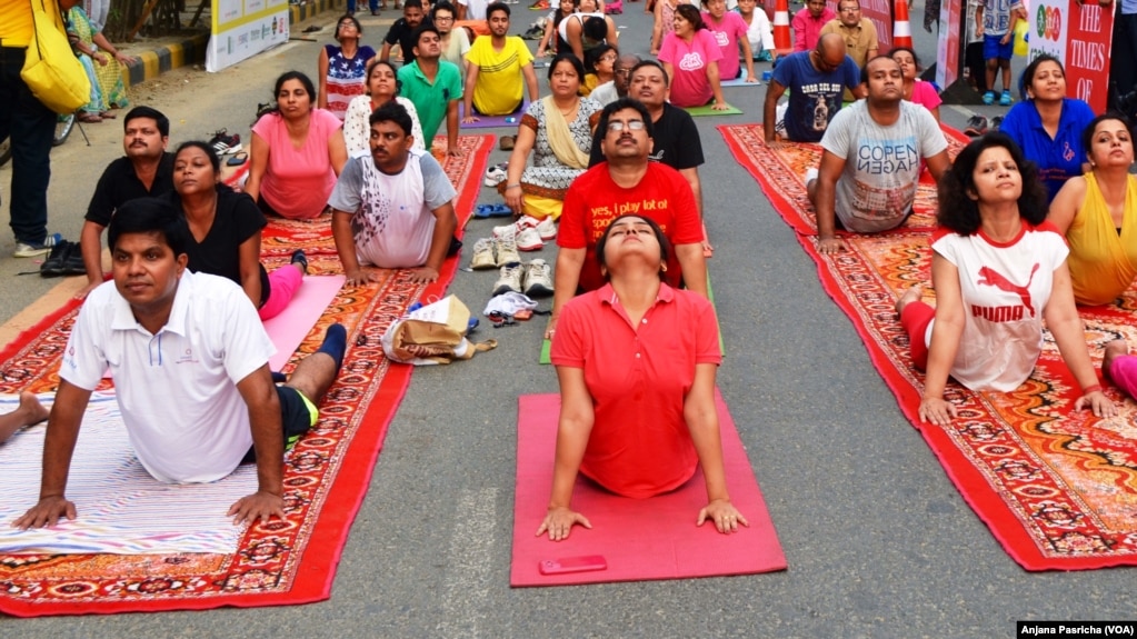 FILE- A yoga class being held in Gurgaon, near New Delhi is one of hundreds of such sessions which are gaining in popularity in India. 