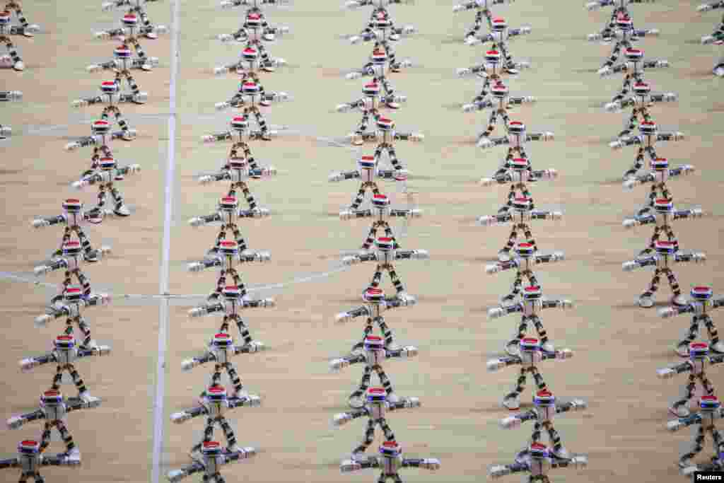 Robots dance during a robot contest in Dezhou, Shandong province, China, Aug. 21, 2017.