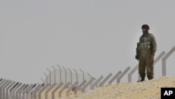 An Israeli soldier secures an area near the border between Israel and Egypt, June 18, 2012.