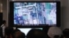 FILE - South Koreans watch a television broadcasting a satellite image of the nuclear facility in North Korea, at the Seoul Railway Station in Seoul, South Korea, Oct. 8, 2013.