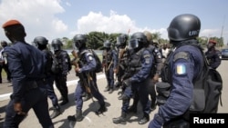 Ivory Coast special forces are seen at Agban gendarmerie camp during French Interior Minister Bernard Cazeneuve and French Foreign Minister Jean-Marc Ayrault visit them, in Abidjan, Ivory Coast, March 15, 2016.