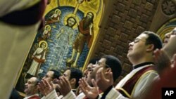 Egyptian Coptic priests pray during Christmas mass at Saint Mark Coptic Orthodox Cathedral in Cairo (file photo)