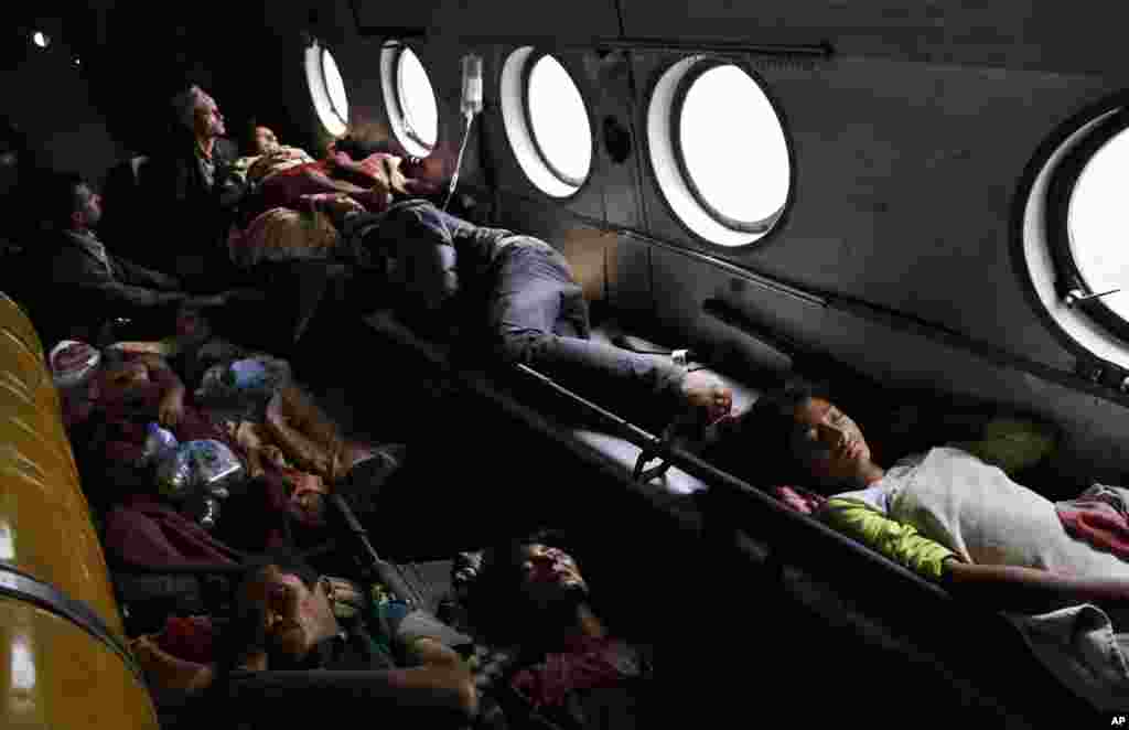 Nepalese victims of Saturday&rsquo;s earthquake lie inside an Indian air force helicopter as they are evacuated from Trishuli Bazar to Kathmandu airport in Nepal.