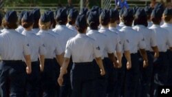 In this June 22, 2012 image taken from video, female airmen march during graduation at Lackland Air Force Base in San Antonio, Texas. (AP)
