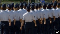 In this June 22, 2012 image taken from video, female airmen march during graduation at Lackland Air Force Base in San Antonio, Texas. (AP)
