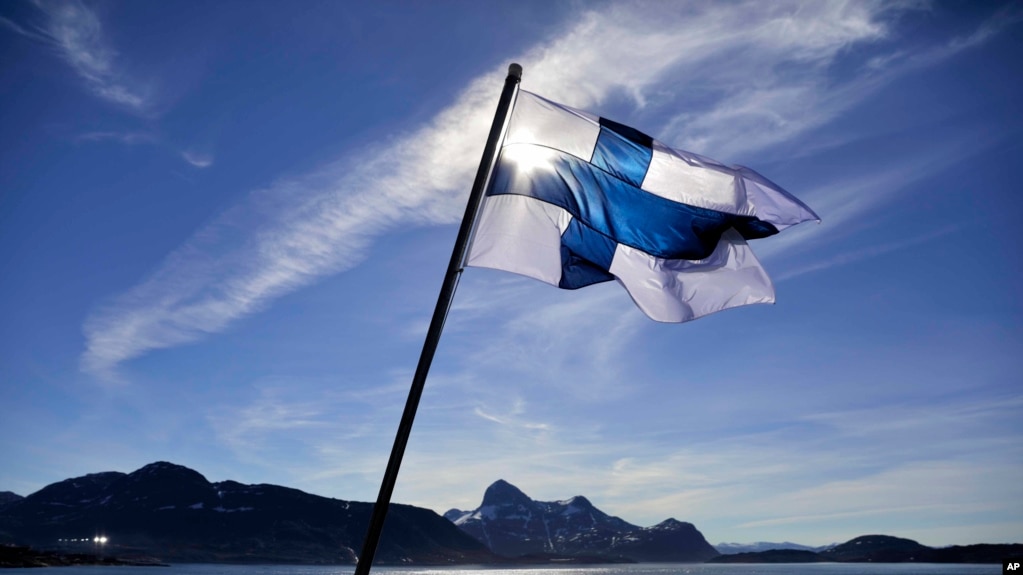 FILE - In this Saturday, July 29, 2017 file photo, Finland's flag flies aboard the Finnish icebreaker MSV Nordica as it arrives into Nuuk, Greenland. Finland has come out on top of an international index that measures nations by how happy they are as plac