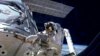 US Astronauts Finish Stage One Spacewalk