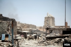 The al-Nuri Mosque, the symbolic heart of IS was bombed by militants in June, and is now in the hands of Iraqi forces, prompting the declaration of victory in Mosul. (H.Murdock)