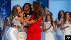 Miss Georgia Betty Cantrell, left, reacts with Miss South Carolina Daja Dial, center, and Miss Oklahoma Georgia Frazier after being named Miss America 2016, Sunday, Sept. 13, 2015.