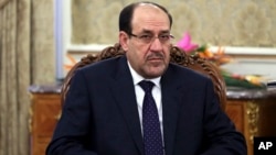 FILE - Iraqi Prime Minister Nouri al-Maliki pictured during a meeting in Tehran, Iran on Dec. 5, 2013.