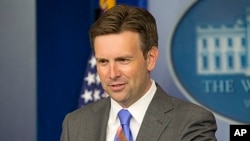 White House principal deputy press secretary Josh Earnest answers questions during his daily news briefing at the White House in Washington, Aug.,19, 2013. 