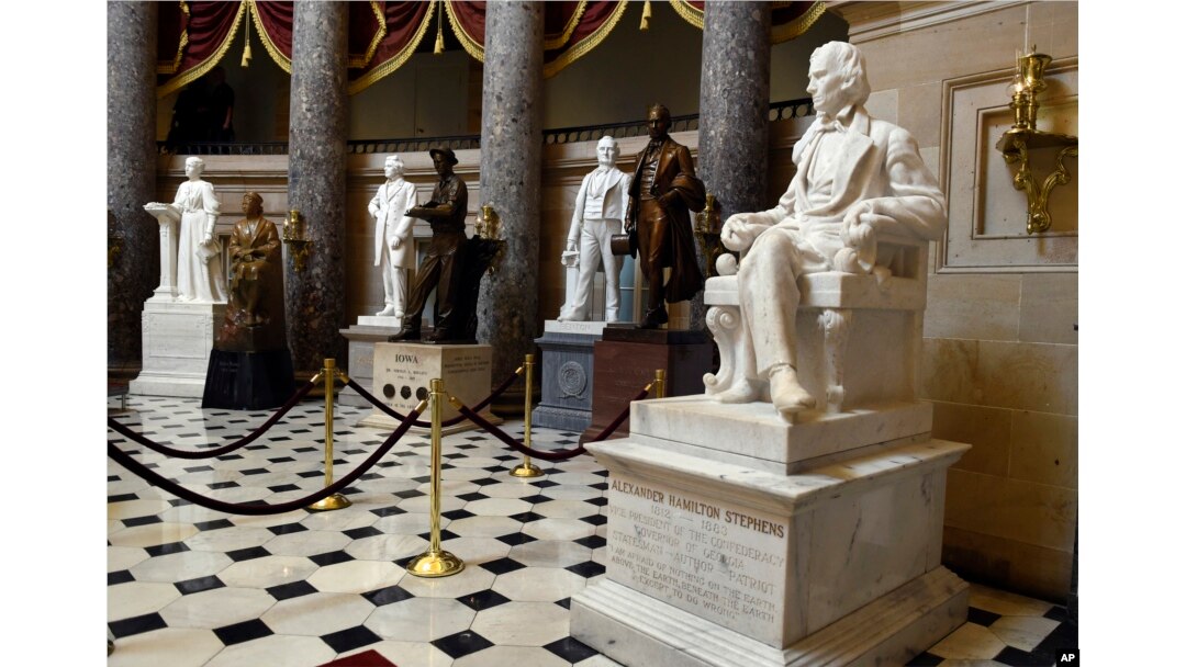 FILE - A statue of Alexander Hamilton Stephens is on display in Statuary Hall on Capitol Hill in Washington, June 24, 2015. The hall includes statues of Confederate Gen. Robert E. Lee, Confederate President Jefferson Davis and a number of other Confederates.