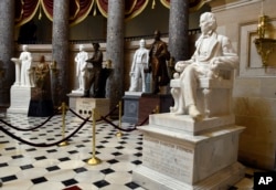 FILE - A statue of Alexander Hamilton Stephens is on display in Statuary Hall on Capitol Hill in Washington, June 24, 2015. The hall includes statues of Confederate Gen. Robert E. Lee, Confederate President Jefferson Davis and a number of other Confederate leaders.