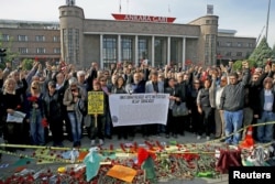 People attend a commemoration for the victims of the October 10 bombings in Ankara, Turkey, Oct. 17, 2015.