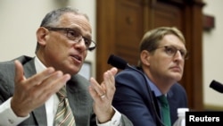 FILE - U.S. Export-Import Bank President Fred Hochberg (L) and Export-Import Bank Deputy Inspector General Michael McCarthy (R) testify before a House Financial Services Committee hearing on the Export-Import Bank's reauthorization, on Capitol Hill.