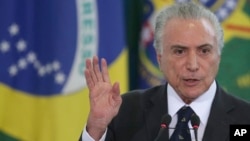 FILE - Brazil's President Michel Temer speaks during a swearing ceremony for the newly-named Foreign Minister Aloysio Nunes and Justice Minister Osmar Serraglio, at the Planalto Presidential Palace, in Brasilia, Brazil, March 7, 2017.