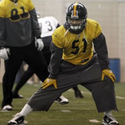 Green Bay Packers linebacker A.J. Hawk wears a Cheesehead hat during  Media Day for Super Bowl XLV in Arlington, Texas on February 1, 2011. The  Pittsburgh Steelers will take on the Green