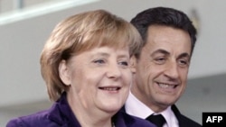 Анґела Меркель і Ніколя Саркозі