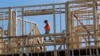 FILE - Workers build an apartment and retail complex in Nashville, Tenn., Oct. 6, 2017.